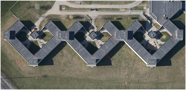Examples of photographs, thermographs and CAD drawings of entrained roof moisture in prison roofs