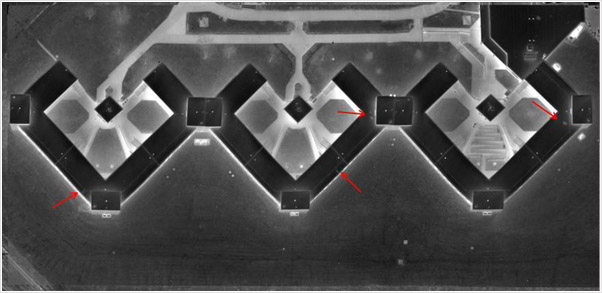 Examples of photographs, thermographs and CAD drawings of entrained roof moisture in prison roofs