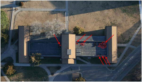 Examples of photographs, thermographs and CAD drawings of entrained roof moisture in prison roofs