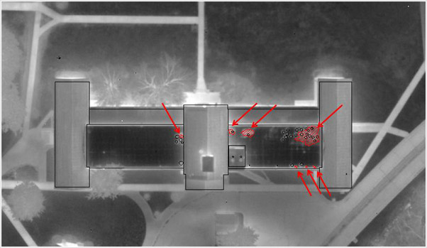 Examples of photographs, thermographs and CAD drawings of entrained roof moisture in prison roofs